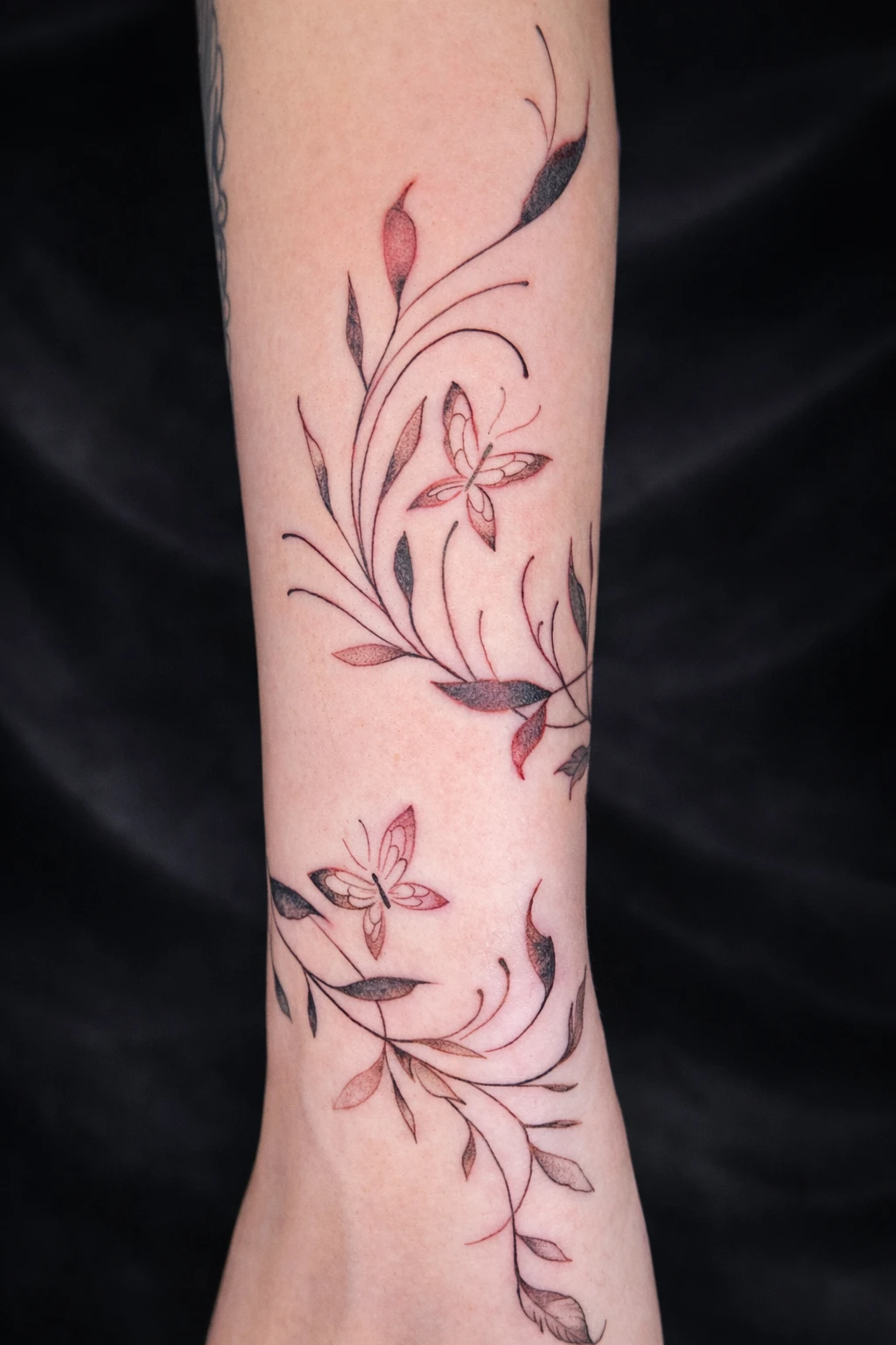 Fine line floral tattoo
