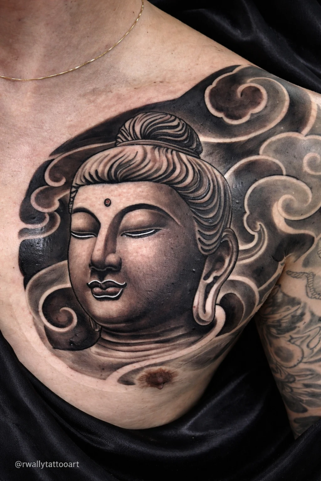 Buddha with clouds tattoo